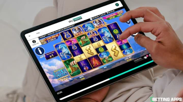 Someone playing Age of the Gods slot game from Sky Casino on an ipad