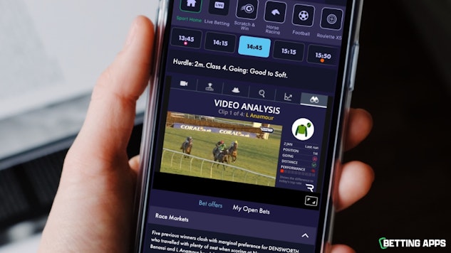 Somone holding an i Phone and looking at the race analysis on the Grosvenor Sport app