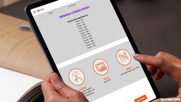 Someone using an ipad to look at the Mr Mega Combo Boost Promo